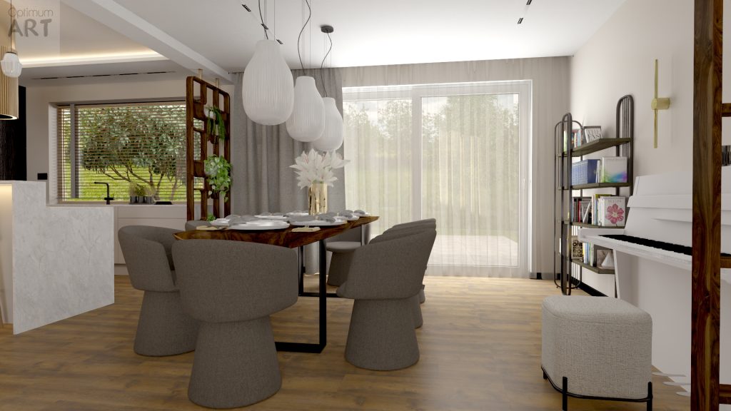 Nowoczesna jadalnia z drewnianym stołem otoczonym szarymi krzesłami o nietypowym kształcie, oświetlona białymi lampami wiszącymi. W pomieszczeniu znajduje się otwarta kuchnia z wyspą, regał z książkami oraz duże okno z widokiem na zieleń.