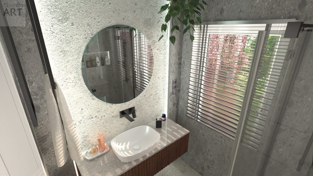Nowoczesna łazienka z okrągłym lustrem na betonowej ścianie, białą umywalką na drewnianej szafce i dużym oknem z żaluzjami. W pomieszczeniu znajduje się także roślina doniczkowa i kabina prysznicowa ze szklanymi ściankami.